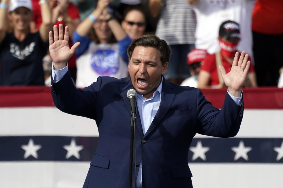 FILE - Florida Gov. Ron DeSantis speaks at a campaign rally for President Donald Trump Oct. 23, 2020, in The Villages, Fla. DeSantis, a leading Republican presidential prospect, has emerged as a potent force in national politics while eschewing the personal connections, intimate moments and unscripted questions that have long fueled successful White House bids. (AP Photo/John Raoux, File)