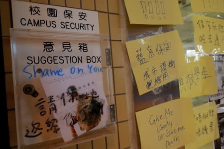 Students at Hong Kong Baptist University take part in a rally after police entered the campus on Sunday while chasing protesters, in Hong Kong