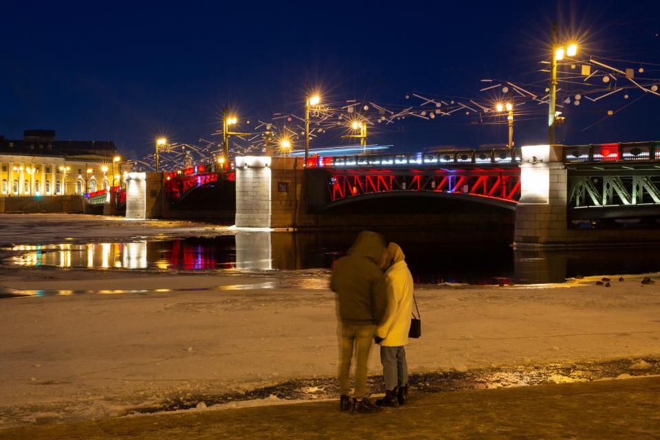 This photo taken on Jan. 21, 2023 shows the Palace Bridge illuminated in red to celebrate the Chinese New Year in St. Petersburg, Russia