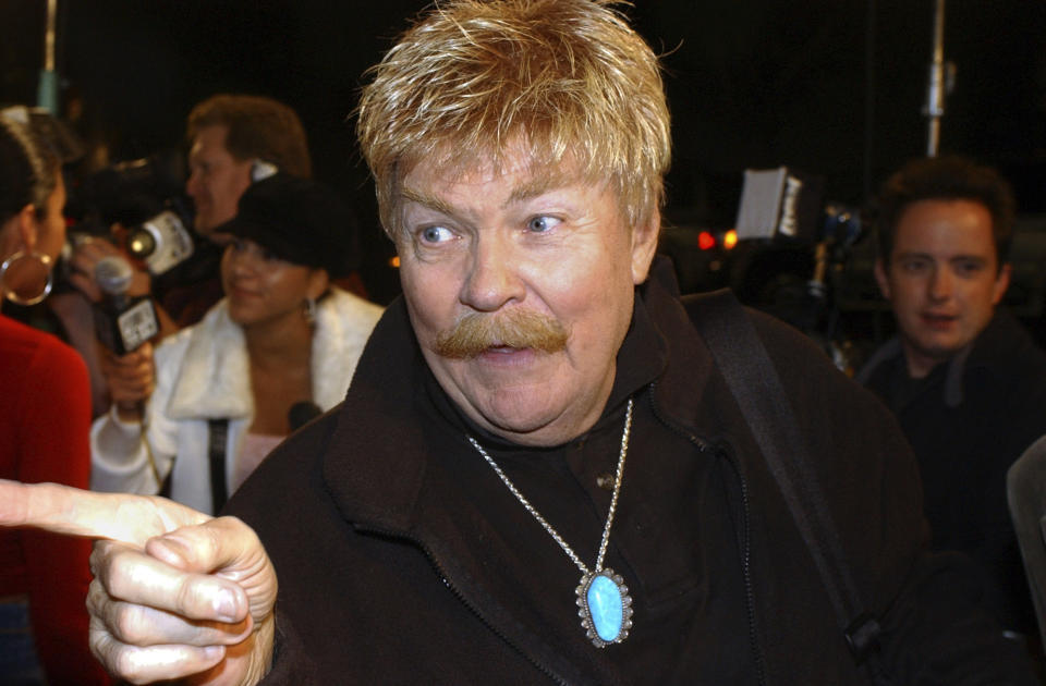 CORRECTS AGE TO 88 - FILE - In this Monday, Oct. 21, 2002, file photo, comedian Rip Taylor talks with reporters before a film premiere, in the Hollywood section of Los Angeles. Taylor, the mustached comedian with a fondness for confetti-throwing who became a television game show mainstay in the 1970s, died Sunday, Oct. 6, 2019. He was 88. (AP Photo/Rene Macura, File)