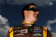 DAYTONA BEACH, FL - FEBRUARY 19: Kyle Busch, driver of the #18 M&M's Brown Toyota, looks on during qualifying for the NASCAR Sprint Cup Series Daytona 500 at Daytona International Speedway on February 19, 2012 in Daytona Beach, Florida. (Photo by Tom Pennington/Getty Images for NASCAR)