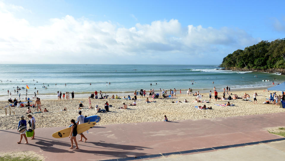 Beachgoers are seen on Noosa Beach in the resort town of Noosa Heads on the Sunshine Coast, Wednesday, July 3, 2013. Source: AAP
