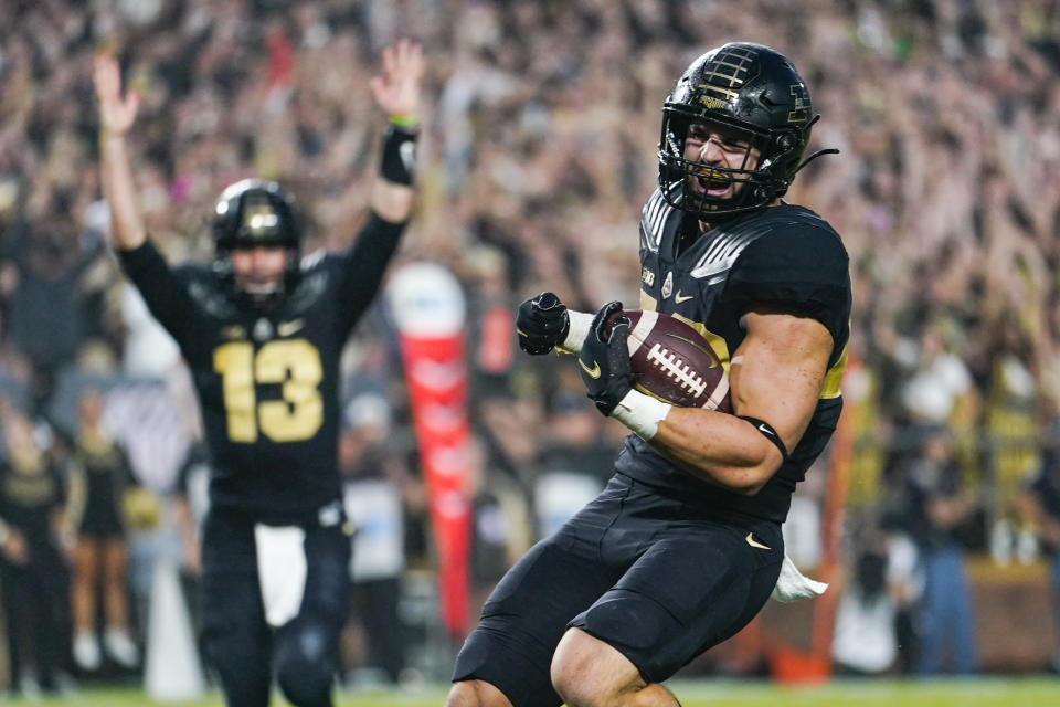 Purdue running back Zander Horvath (40) celebrates a touchdown with quarterback Jack Plummer (13) against Oregon State during the first half of an NCAA college football game in West Lafayette, Ind., Saturday, Sept. 4, 2021. (AP Photo/Michael Conroy)