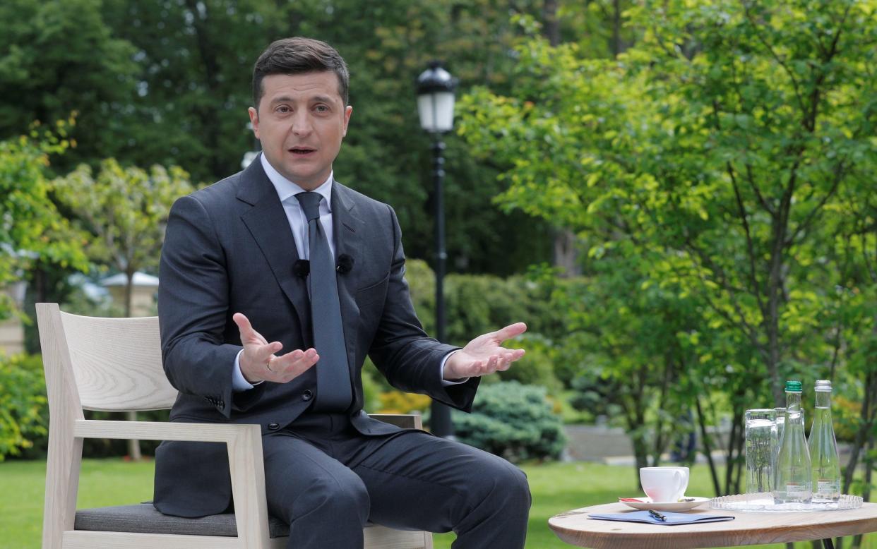 Ukrainian President Volodymyr Zelenskiy gestures during an open-air news conference in Kiev - Gesturing while speaking or 'talking with your hands' makes your voice louder, scientists find - REUTERS