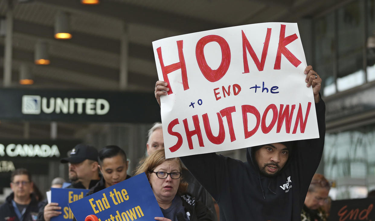 More than two dozen federal employees and supporters demonstrate at the Sacramento International Airport calling for President Donald Trump and Washington lawmakers to end then partial government shutdown, Wednesday, Jan. 16, 2019, in Sacramento, Calif. (Photo: Rich Pedroncelli/AP)