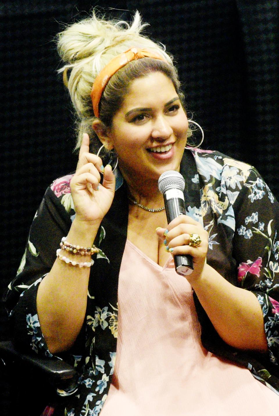 Jaya McSharma speaks to the audience during the StorytellHERS event, Thursday, March 31, at The Robinson Film Center.