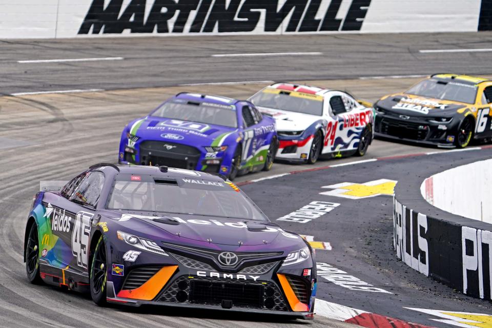 Bubba Wallace (45) leads a pack of cars during the Oct. 30, 2022 playoff race at Martinsville Speedway.