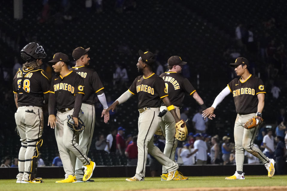 San Diego Padres celebrate the team's 12-5 win over the Chicago Cubs in a baseball game Tuesday, June 14, 2022, in Chicago. (AP Photo/Charles Rex Arbogast)