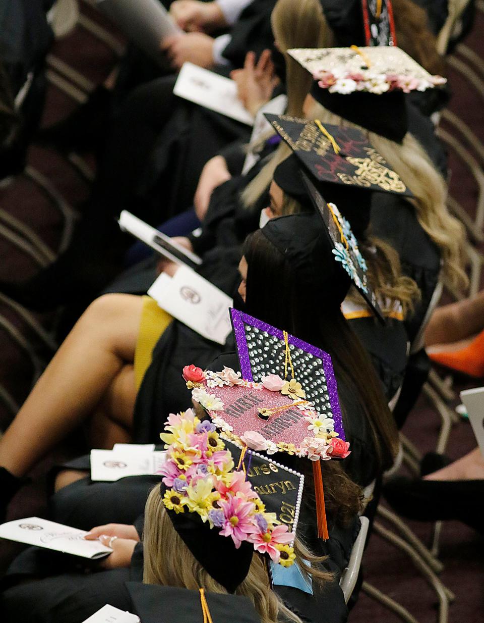 Graduates listen as AU alumna and Olympic gold medalist Katie Nageotte gives the address at Ashland University's Winter Commencement on Saturday.