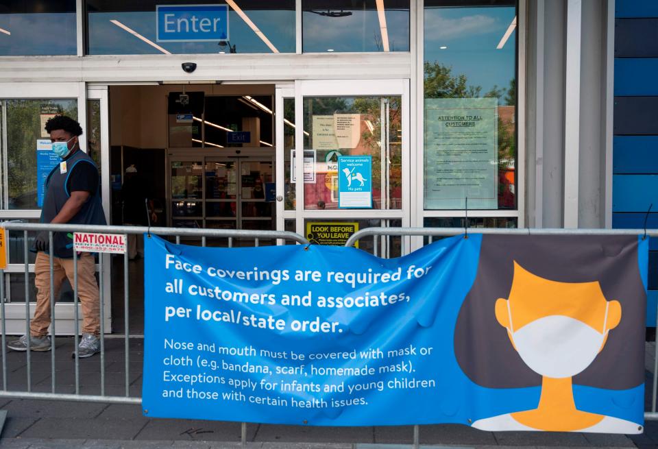 Face coverings are required at a Walmart in Washington. The chain announced in July that it would require masks in areas of substantial or high transmission because of increasing coronavirus cases.