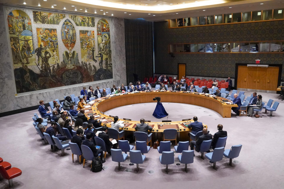 FILE - Sudanese Ambassador to the United Nations Al-Harith Idriss Al-Harith Mohamed, third from right bottom, listens as Karim Khan, third from right top, Prosecutor of International Criminal Court, addresses a Security Council meeting on the situation in Sudan, Thursday, July 13, 2023, at United Nations headquarters. Sudan has been torn by war for a year now, torn by fighting between the military and the notorious paramilitary Rapid Support Forces. (AP Photo/Mary Altaffer, File)