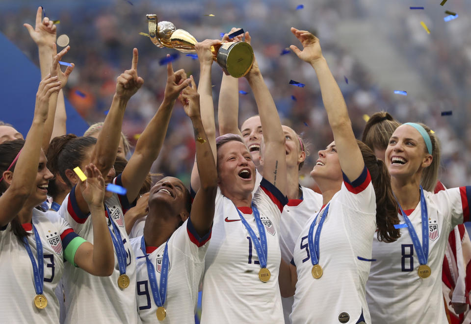 FILE - United States' Megan Rapinoe holds the trophy celebrating at the end of the Women's World Cup final soccer match between US and The Netherlands at the Stade de Lyon in Decines, outside Lyon, France, Sunday, July 7, 2019. (AP Photo/Francisco Seco, File)