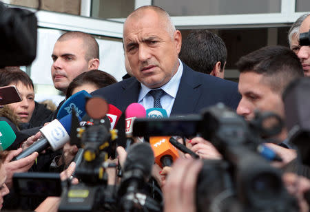 Bulgarian Prime Minister Boiko Borisov speaks to the media after casting his vote at a polling station in Sofia, Bulgaria, November 13, 2016. REUTERS/Dimitar Kyosemarliev