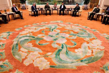 U.S. Chairman of the Joint Chiefs of Staff Gen. Joseph Dunford chats with President Xi Jinping during a meeting at the Great Hall of the People in Beijing, China August 17, 2017. REUTERS/Andy Wong/Pool