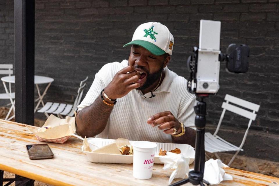 Influencer Jordan Williams tries a wagyu sloppy joe at Cheezy Does It, a new food truck in Fort Worth, on Friday, March 9, 2023. Williams reviews food on social media at @dubbsgrubs and has amassed thousands of followers.