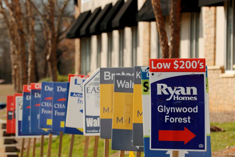 FILE PHOTO: Real estate signs advertise new homes for sale in multiple new developments in York County, South Carolina