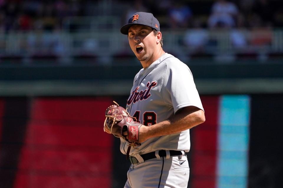 Detroit Tigers relief pitcher Derek Law (48) reacts after loading the bases against the Minnesota Twins during the eighth inning of a baseball game Wednesday, Aug. 3, 2022, in Minneapolis.