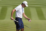 Collin Morikawa bounces a ball off his putter after finishing the second hole during a practice round for The Players Championship golf tournament Wednesday, March 13, 2024, in Ponte Vedra Beach, Fla. (AP Photo/Chris O'Meara)