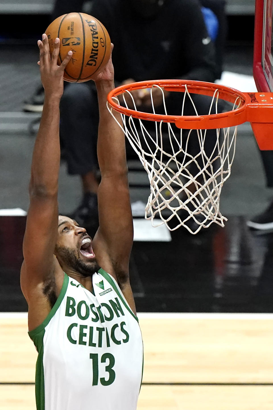 Boston Celtics center Tristan Thompson dunks against the Chicago Bulls during the first half of an NBA basketball game in Chicago, Friday, May 7, 2021. (AP Photo/Nam Y. Huh)