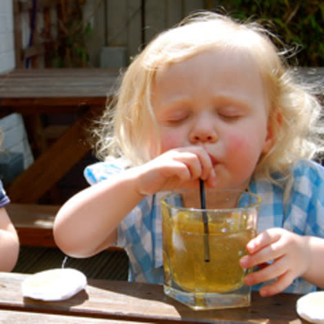 Child drinking apple juice