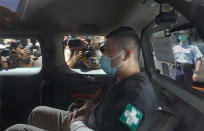 File- In this Monday, July 6, 2020, file photo, Tong Ying-kit, 23 years old, arrives at a court for the violation of the new security law after carrying a flag reading "Liberate Hong Kong, Revolution of our times" during a protest in Hong Kong. Tong has been sentenced to nine years in prison in the closely watched first case under Hong Kong’s national security law as Beijing tightens control over the territory. (AP Photo/Vincent Yu, File)