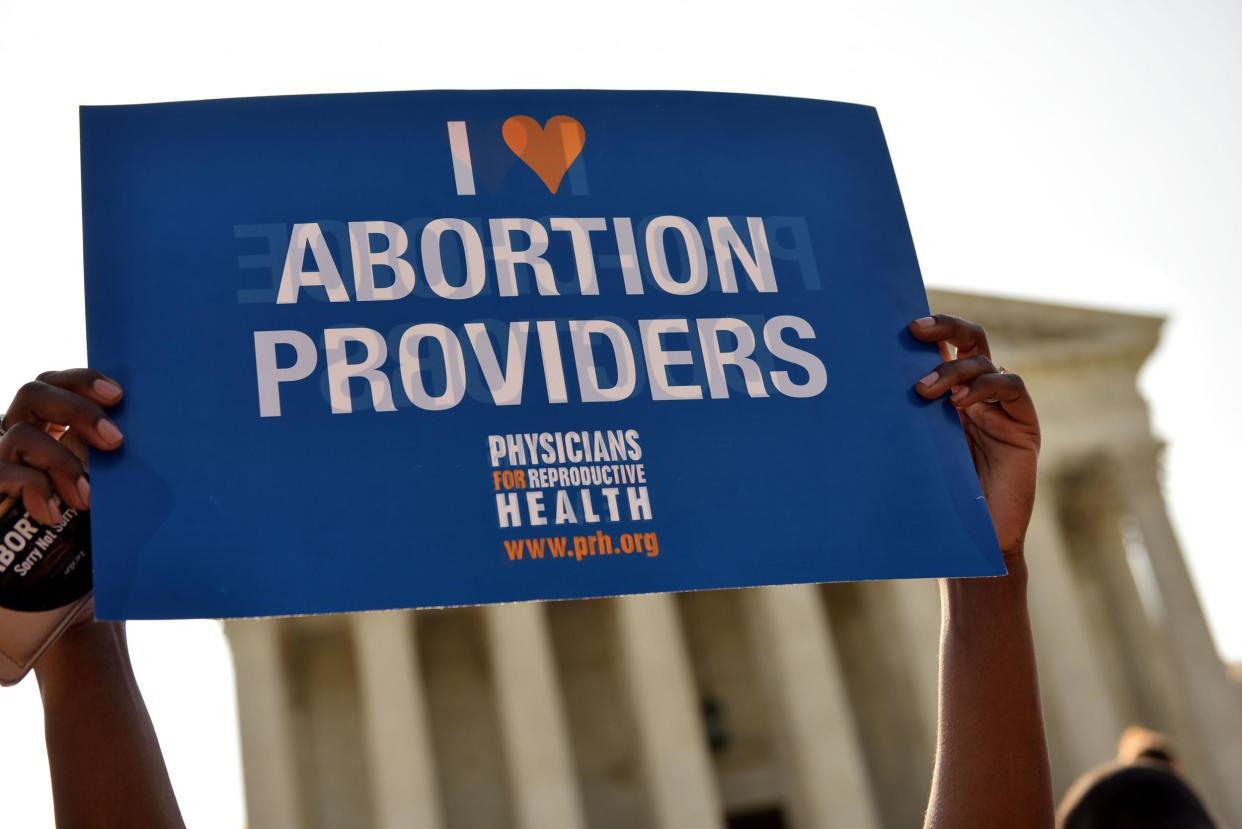 An abortion rights activist holds a placard outside the US Supreme Court last year after Whole Woman's Health helped overturn some of Texas' restrictive abortion laws: AFP / Getty Images / Mandel Ngan