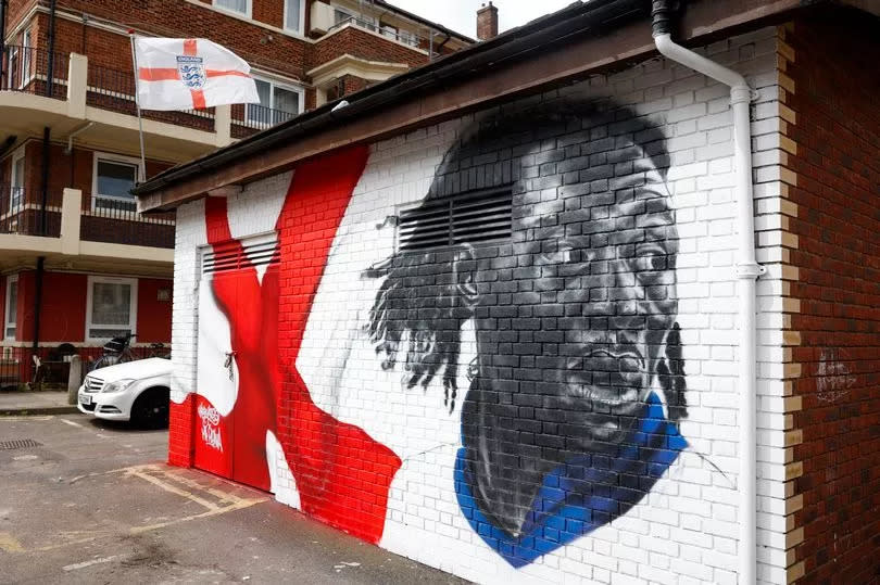 A mural of Eze in the Kirby Estate in east London