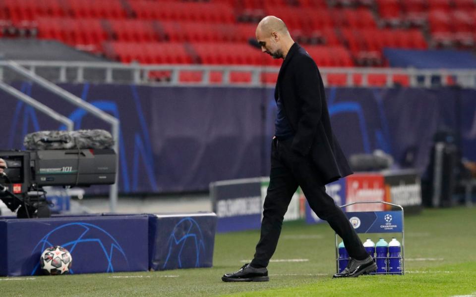 Pep Guardiola in a big coat - REUTERS