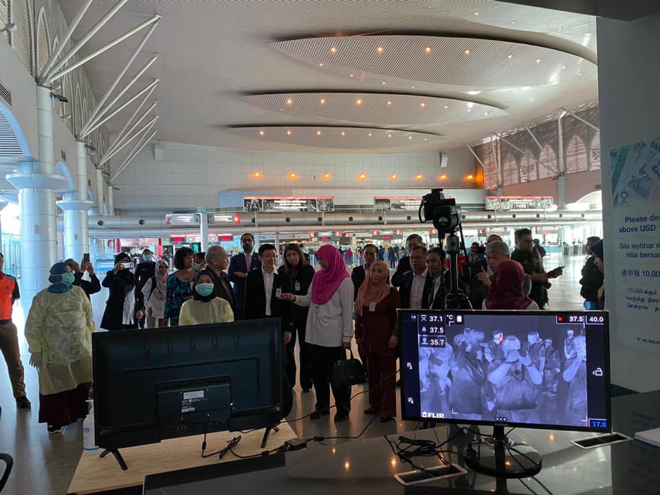 Delegates of the joint working group between Singapore and Malaysia observe the border health screening facilities at the JB Customs, Immigration and Quarantine Complex. (PHOTO: Ministry of Health/Facebook)