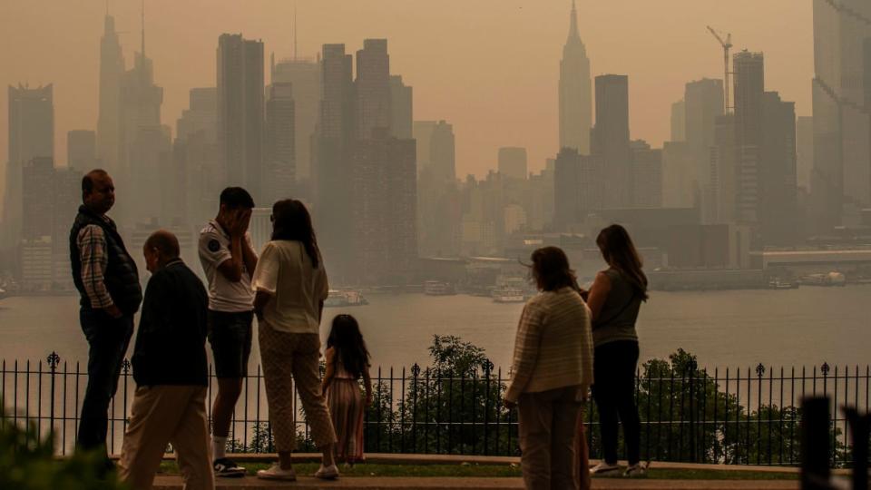 <div class="inline-image__caption"><p>People stand in a park as the New York City skyline is covered with haze and smoke from Canada wildfires on June 7, 2023 in Weehawken, New Jersey. Air pollution alerts were issued across the United States due to smoke from wildfires that have been burning in Canada for weeks.</p></div> <div class="inline-image__credit">Eduardo Munoz Alvarez / Getty</div>