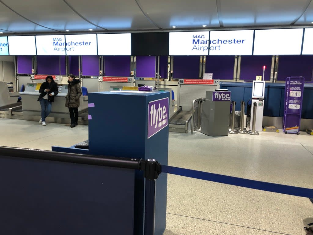 Check-in desks are shown at Manchester Airport.  (PA)