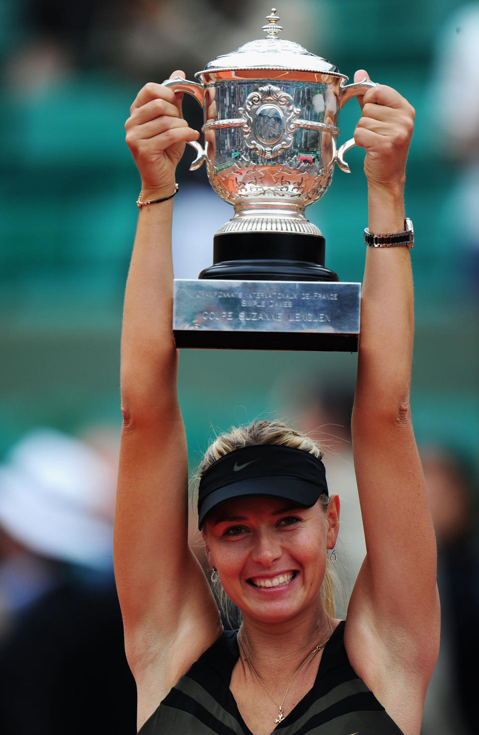 PARIS, FRANCE - JUNE 09: Maria Sharapova of Russia celebrates with the Coupe Suzanne Lenglen after the women's singles final against Sara Errani of Italy during day 14 of the French Open at Roland Garros on June 9, 2012 in Paris, France. (Photo by Mike Hewitt/Getty Images)