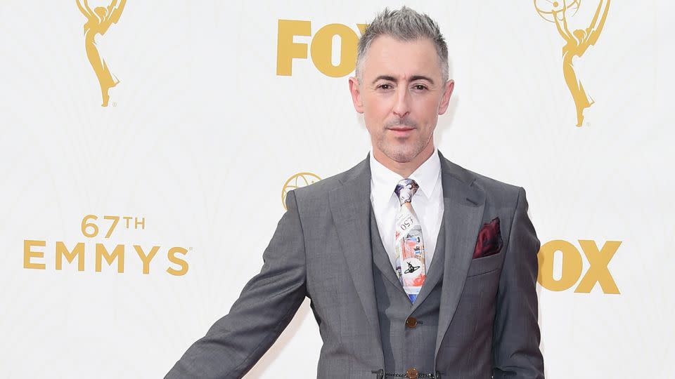 Alan Cumming attends the 67th Primetime Emmy Awards on September 20, 2015 in a Vivienne Westwood suit and black Crocs. - Jason Merritt/Getty Images