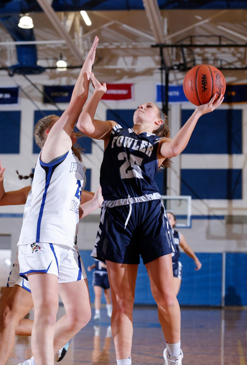 Fowler's Mia Riley, right, shoots against Bath's Anna Schaibly, Friday, Dec. 10, 2021, in Bath, Mich. Fowler won 54-22.