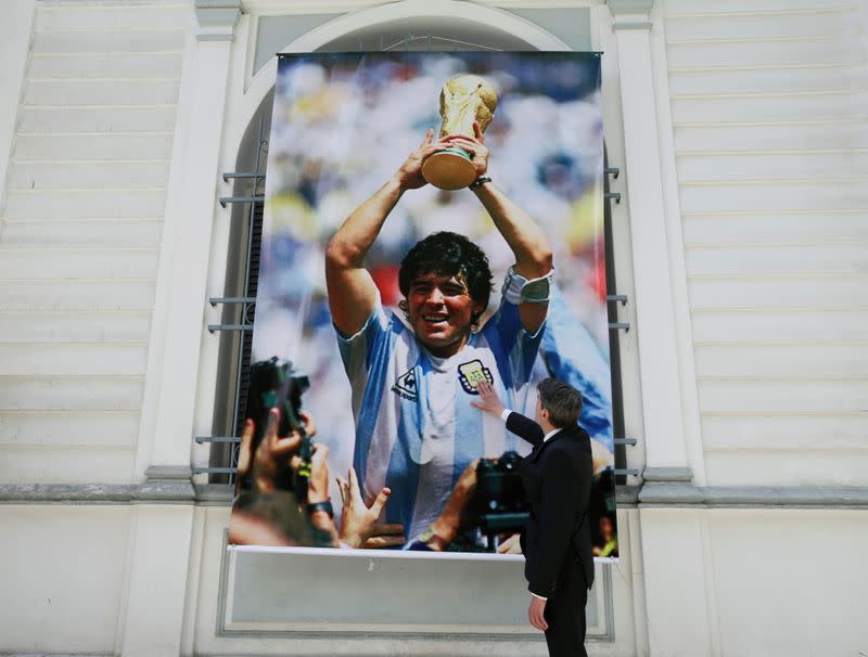 Charge d'affaires of the Argentine embassy Diego Alonso mourns the death of soccer legend Diego Armando Maradona, outside the Argentine embassy building in La Paz