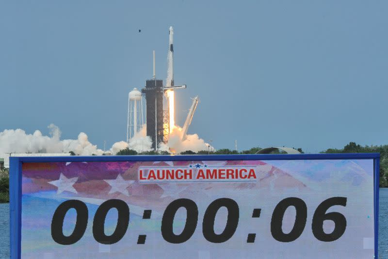 A count down clock is shown as SpaceX Falcon 9 rocket and Crew Dragon spacecraft carrying NASA astronauts Douglas Hurley and Robert Behnken lifts off during NASA's SpaceX Demo-2 mission to the International Space Station from NASA's Kennedy Space Center