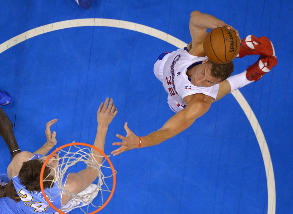 Los Angeles Clippers forward Blake Griffin, right, goes up for a dunk as Denver Nuggets forward Jan Vesely, of the Czech Republic, defends during the first half of an NBA basketball game, Tuesday, April 15, 2014, in Los Angeles. (AP Photo/Mark J. Terrill)