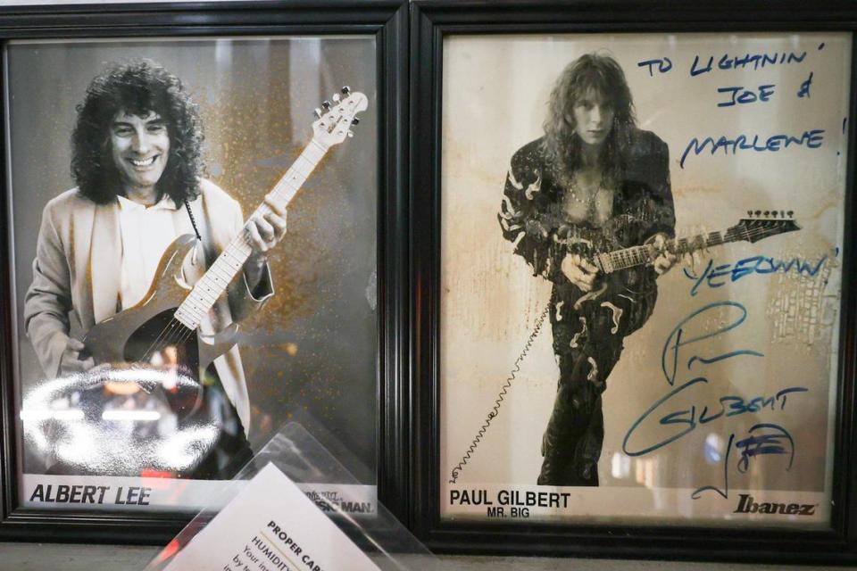 Autographed photos from from professional musicians line the walls at Lightning Joe’s Guitar Heaven in Arroyo Grande.
