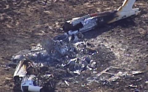  wreckage of a helicopter that crashed in a mountainous rural area of northern New Mexico - Credit: KOAT-TV/AP 