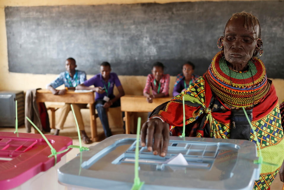 <p>A Turkana tribeswoman casts her ballot at a polling station during the election in a village near Baragoy, Kenya, Aug. 8, 2017. (Photo: /Goran Tomasevic/Reuters) </p>