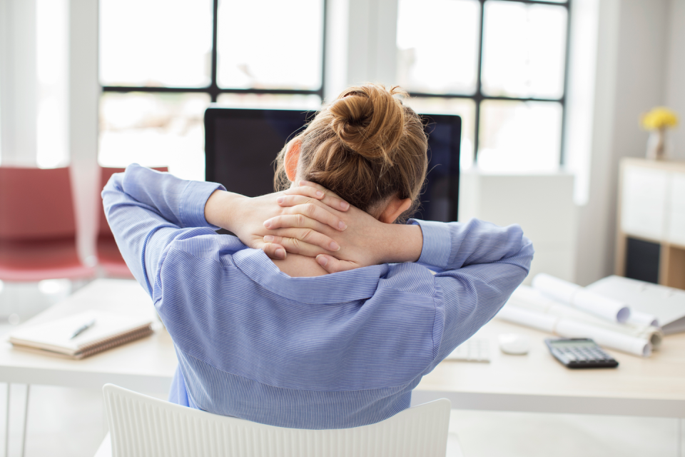 woman neck pain at desk