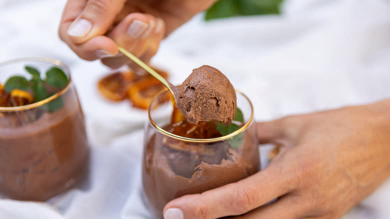 Chocolate mousse in glass with spoon
