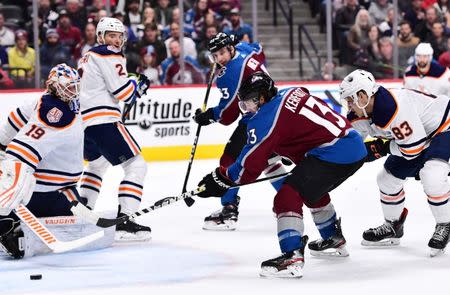 Apr 2, 2019; Denver, CO, USA; Colorado Avalanche center Alexander Kerfoot (13) shoots and score past Edmonton Oilers goaltender Mikko Koskinen (19) in the second period at the Pepsi Center. Mandatory Credit: Ron Chenoy-USA TODAY Sports