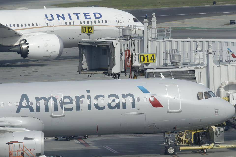 United Airlnes and American Airlnes planes are shown on the tarmac from an outdoor terrace and observation deck at San Francisco International Airport in San Francisco, Thursday, Feb. 20, 2020. (AP Photo/Jeff Chiu)