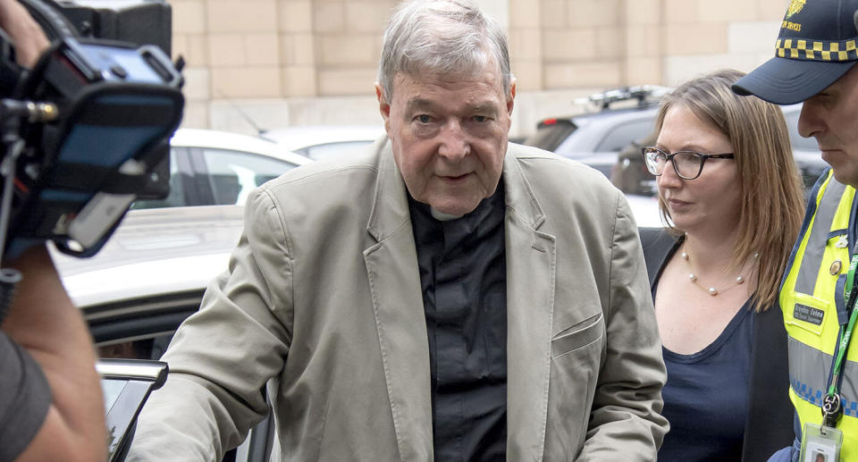 In this Feb. 26, 2019, photo, Cardinal George Pell arrives at the County Court in Melbourne, Australia.