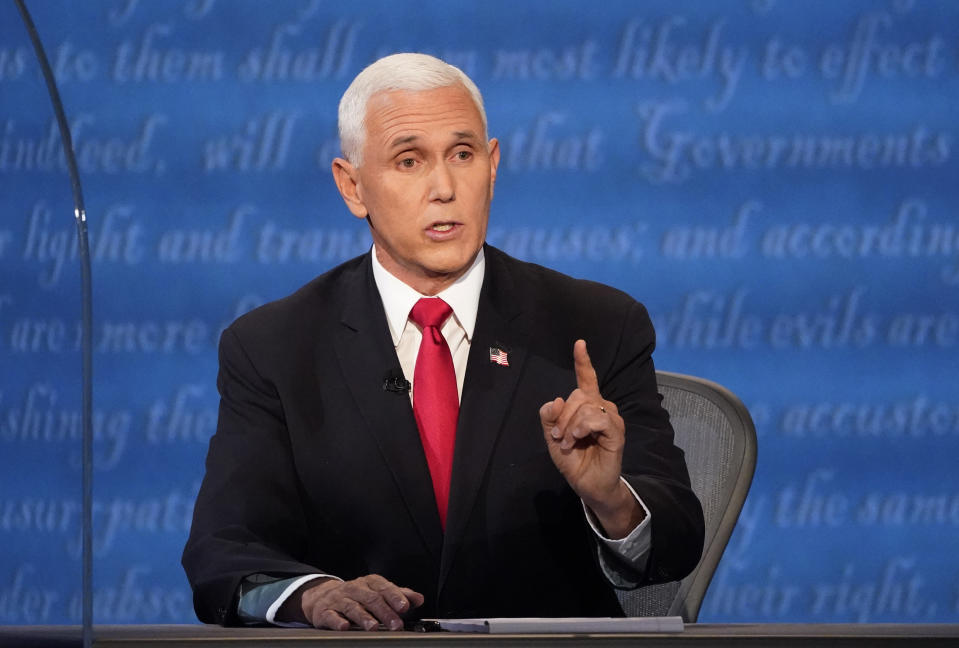 Vice President Mike Pence makes a point during the vice presidential debate with Democratic vice presidential candidate Sen. Kamala Harris, D-Calif., Wednesday, Oct. 7, 2020, at Kingsbury Hall on the campus of the University of Utah in Salt Lake City. (AP Photo/Julio Cortez)