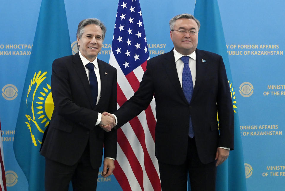 U.S. Secretary of State Antony Blinken, left, shakes hands with Kazakhstan's Foreign Minister Mukhtar Tleuberdi during their meeting at the Ministry of Foreign Affairs in Astana, Kazakhstan Tuesday, Feb. 28, 2023. (Olivier Douliery/Pool Photo via AP)
