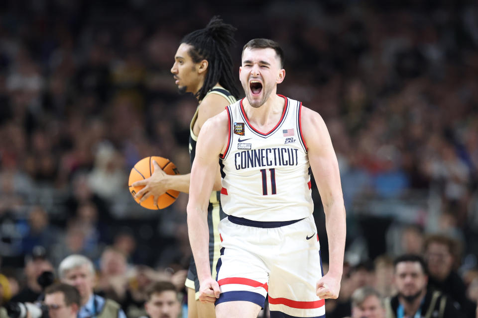 GLENDALE, ARIZONA - APRIL 08: Alex Karaban #11 of the Connecticut Huskies reacts in the second half against the Purdue Boilermakers during the NCAA Men's Basketball Tournament National Championship game at State Farm Stadium on April 08, 2024 in Glendale, Arizona. (Photo by Christian Petersen/Getty Images)