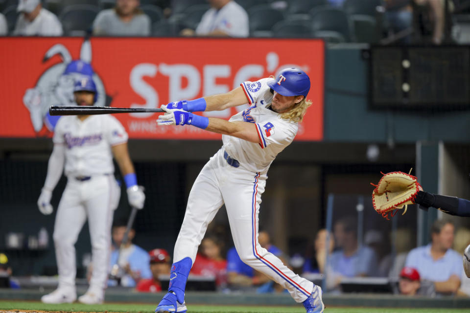 Texas Rangers’ <a class="link " href="https://sports.yahoo.com/mlb/players/10050/" data-i13n="sec:content-canvas;subsec:anchor_text;elm:context_link" data-ylk="slk:Travis Jankowski;sec:content-canvas;subsec:anchor_text;elm:context_link;itc:0">Travis Jankowski</a>, center, swings at but misses a pitch from Cleveland Guardians starter Tanner Bibee during the fifth inning of a baseball game, Monday, May 13, 2024, in Arlington, Texas. (AP Photo/Gareth Patterson)