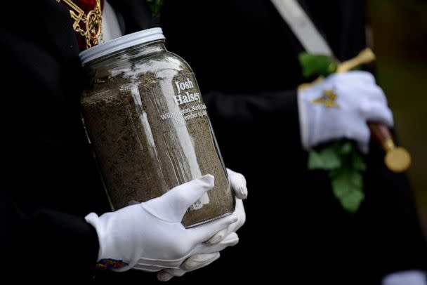 PHOTO: In this Nov. 6, 2021, file photo, community members gather at the Pine Forest Cemetery to honor Joshua Halsey who was killed in an attack attributed to a white supremacist mob in 1898, in Wilmington, North Carolina. (Melissa Sue Gerrits/Getty Images, FILE)